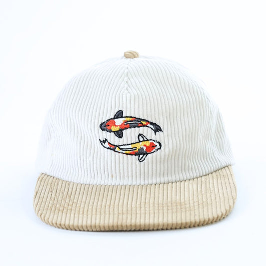 White and beige 5 panel cap with embroidered koi fish carp design embroidered on front panel