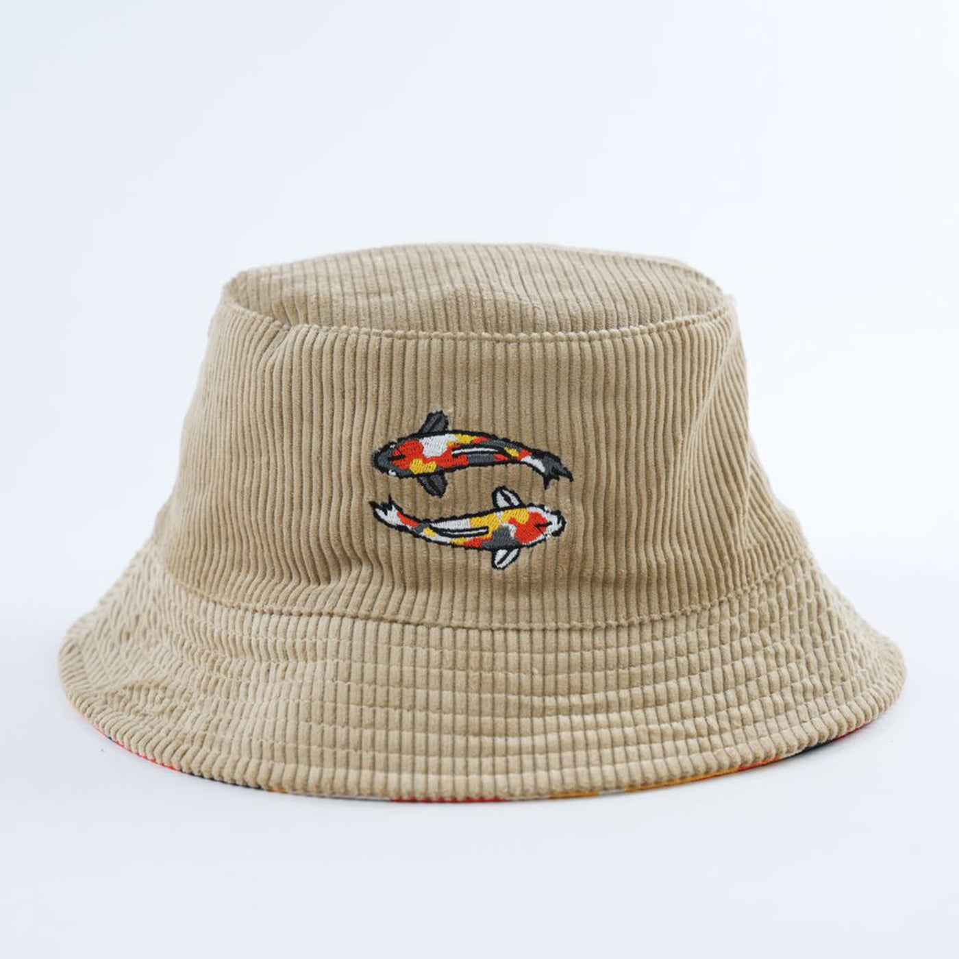 Beige tan corduroy bucket hat with embroidered fish design