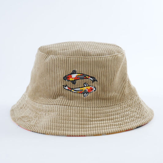 Beige tan corduroy bucket hat with embroidered fish design