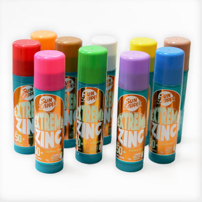 Extreme Zinc sunscreen sticks in various colors on a white background
