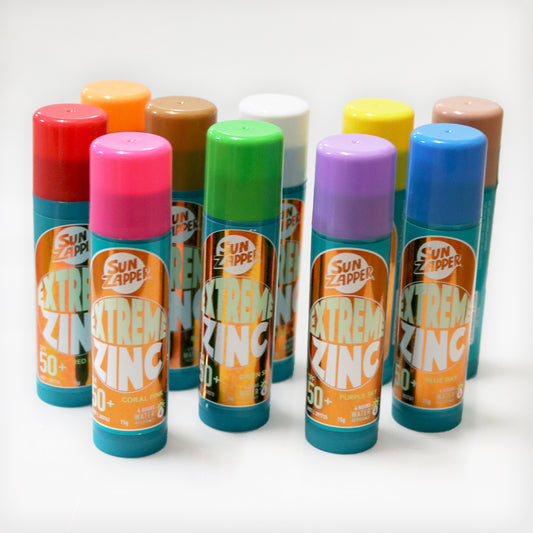 Extreme Zinc sunscreen sticks in various colors on a white background